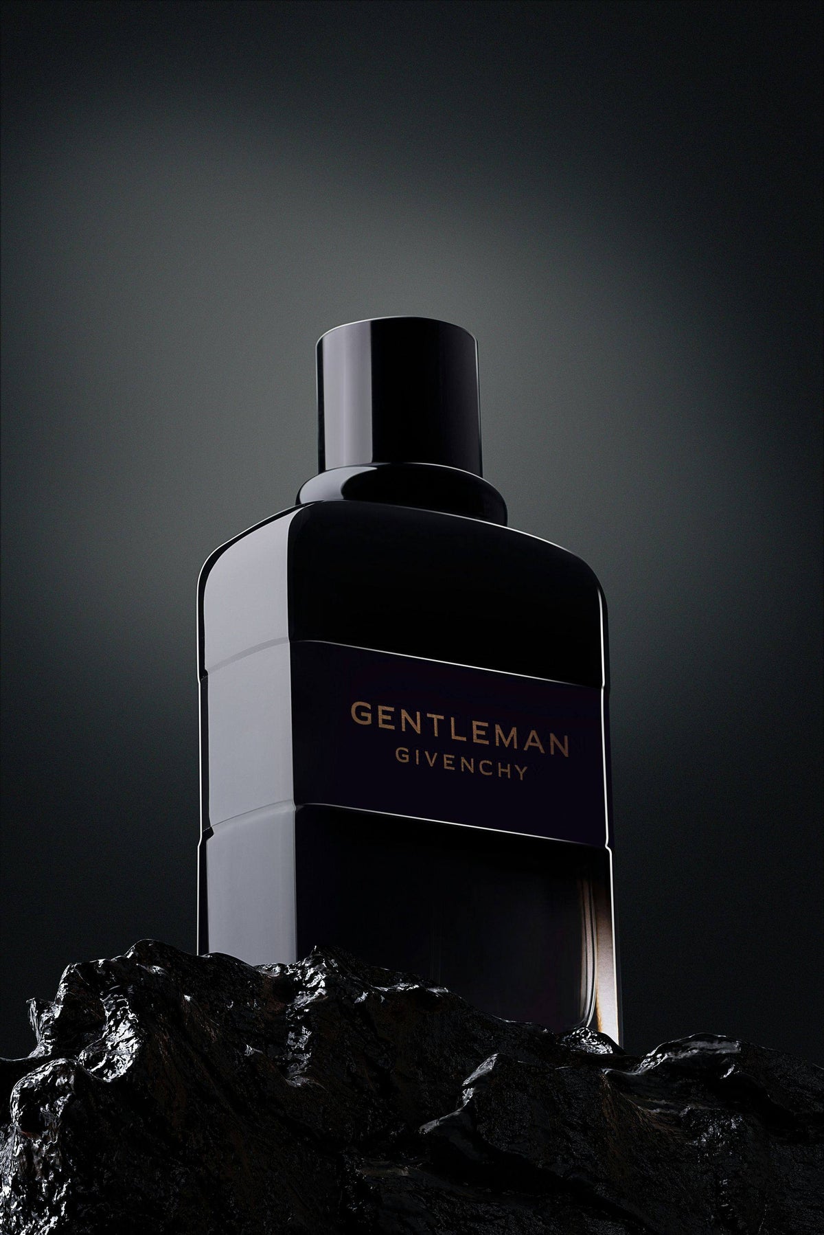 Luxury perfume bottles on black silk — Elixir House